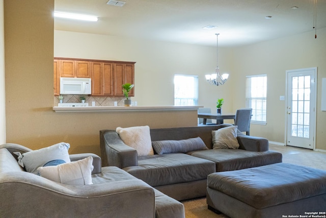 living room featuring a notable chandelier