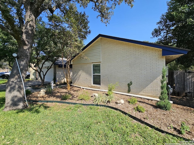 view of home's exterior with a yard