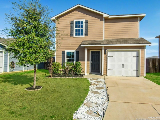 view of front property featuring a garage and a front lawn