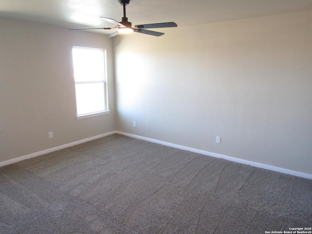 carpeted empty room with ceiling fan