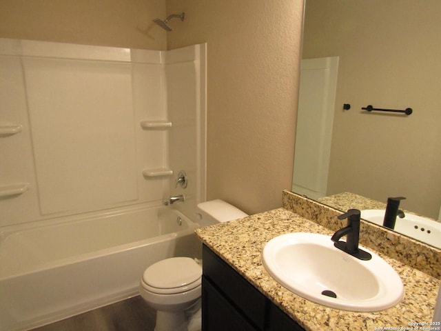 full bathroom featuring vanity, toilet, shower / bath combination, and hardwood / wood-style floors