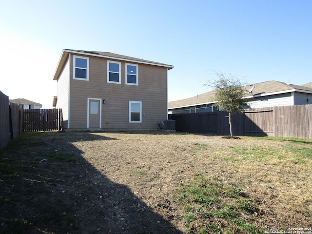 rear view of house with cooling unit