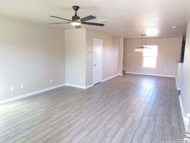 unfurnished room featuring light hardwood / wood-style floors and ceiling fan