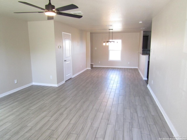 unfurnished room featuring ceiling fan and light hardwood / wood-style flooring