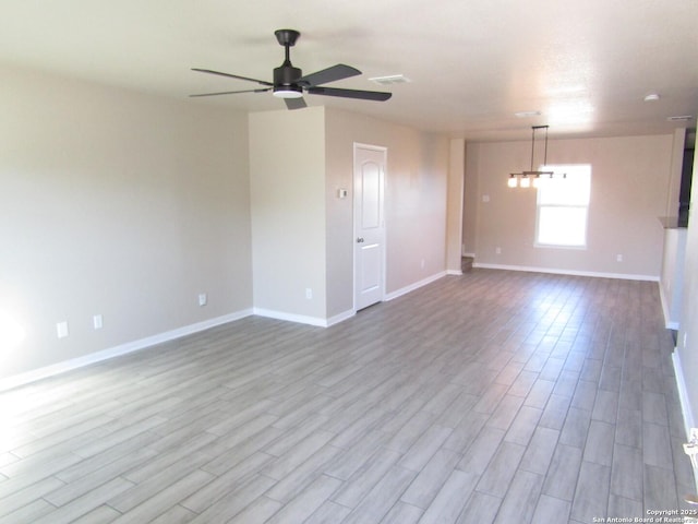 unfurnished room with light hardwood / wood-style flooring and ceiling fan