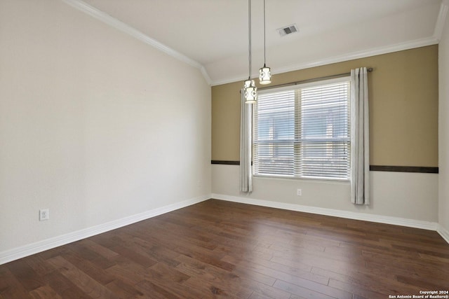 spare room with crown molding, lofted ceiling, and dark hardwood / wood-style flooring