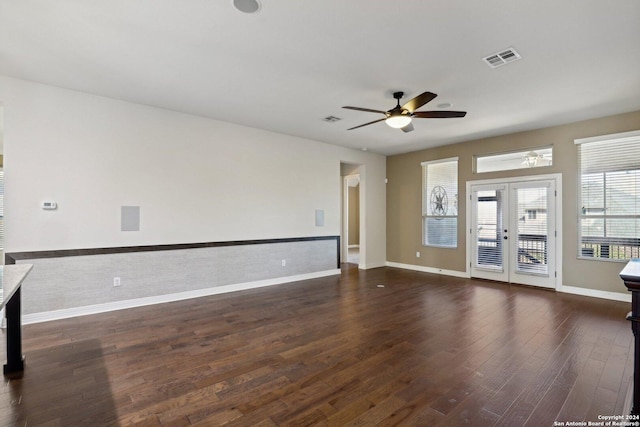 empty room with dark wood-type flooring, french doors, and ceiling fan