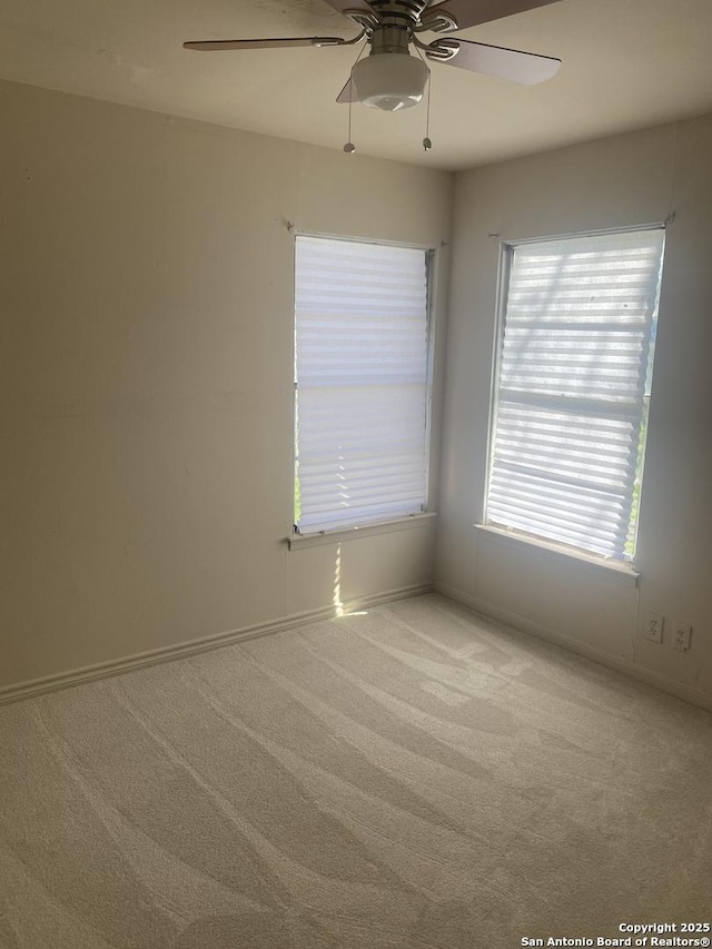 carpeted empty room with ceiling fan