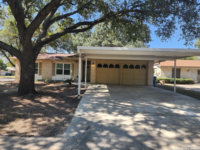 ranch-style home featuring a garage