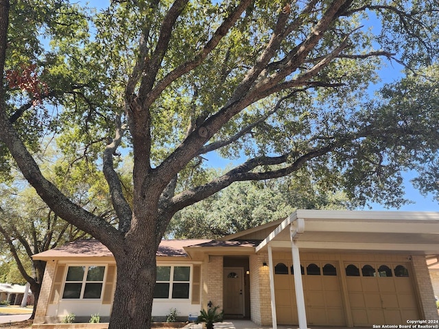 ranch-style home with a garage