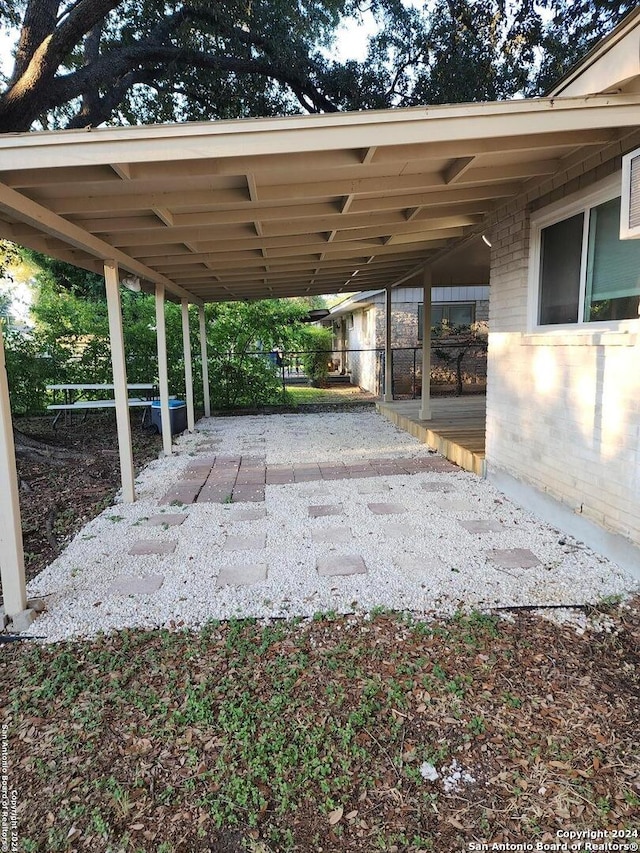 view of parking with a carport