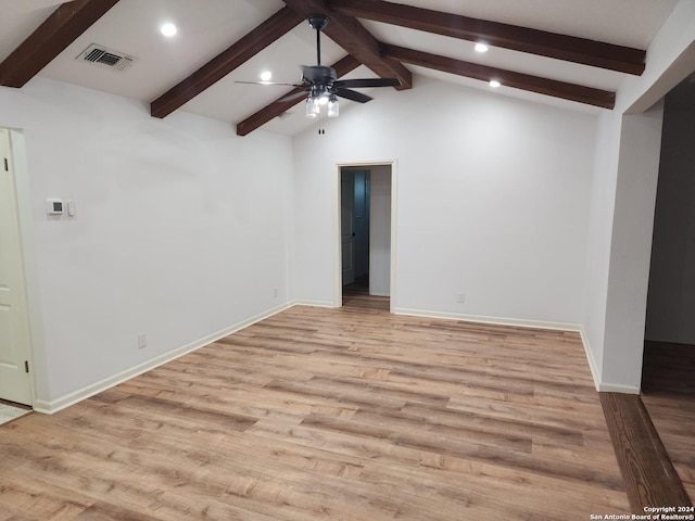 unfurnished room with lofted ceiling with beams, light hardwood / wood-style floors, and ceiling fan