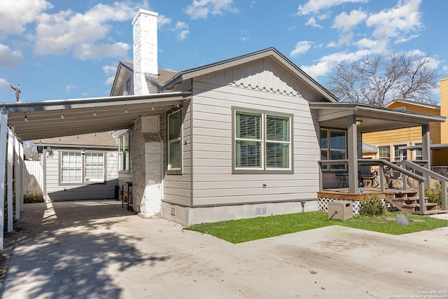 exterior space with a carport