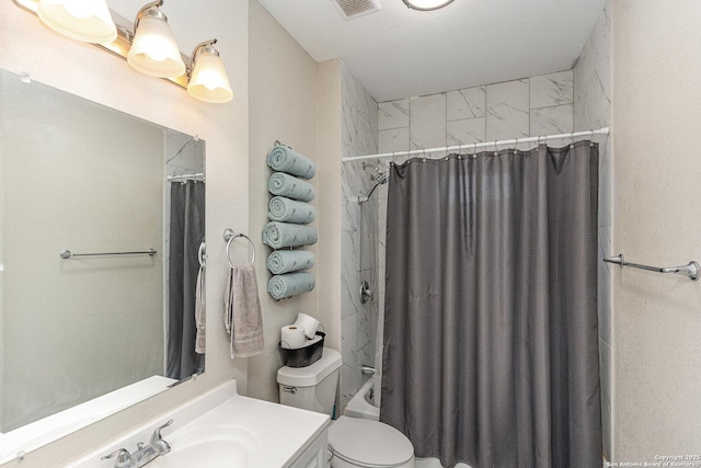 full bathroom featuring vanity, toilet, and shower / tub combo with curtain