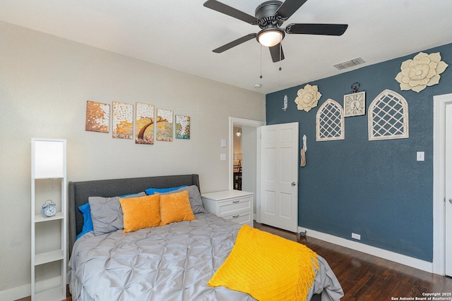 bedroom featuring ceiling fan and dark hardwood / wood-style floors