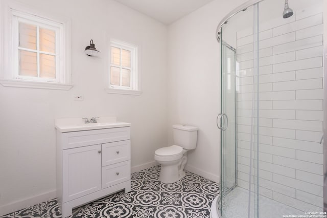 bathroom featuring a shower with shower door, tile patterned floors, toilet, and a healthy amount of sunlight