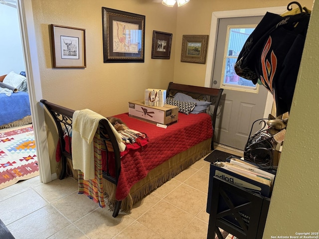 bedroom with light tile patterned flooring