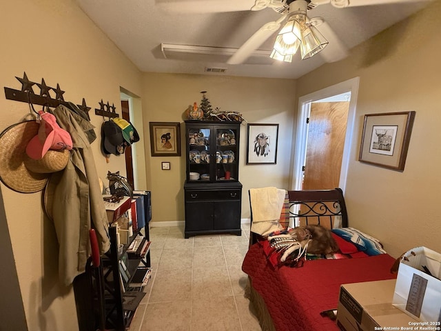 tiled bedroom with ceiling fan