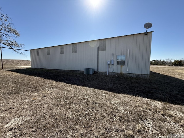 view of property exterior featuring central AC