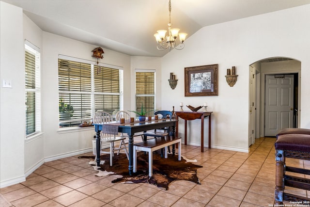 dining area featuring an inviting chandelier, vaulted ceiling, and light tile patterned flooring