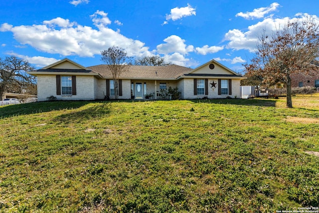 single story home featuring a front lawn