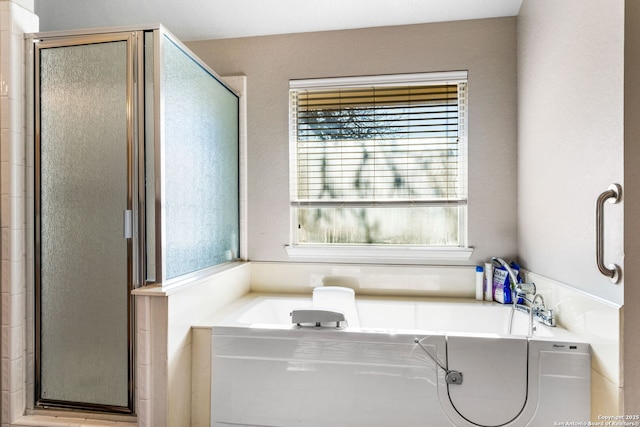 bathroom with independent shower and bath