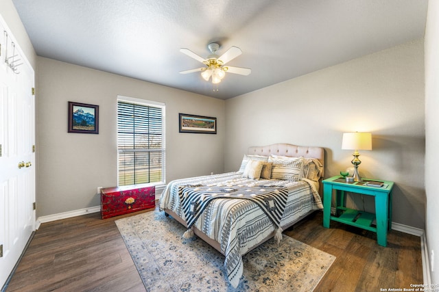 bedroom featuring dark hardwood / wood-style floors and ceiling fan