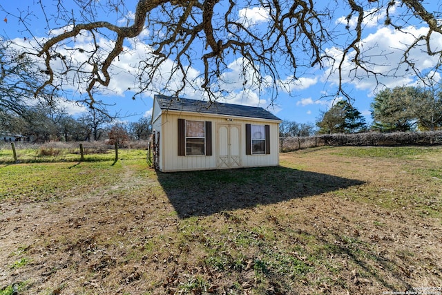 view of outdoor structure with a lawn