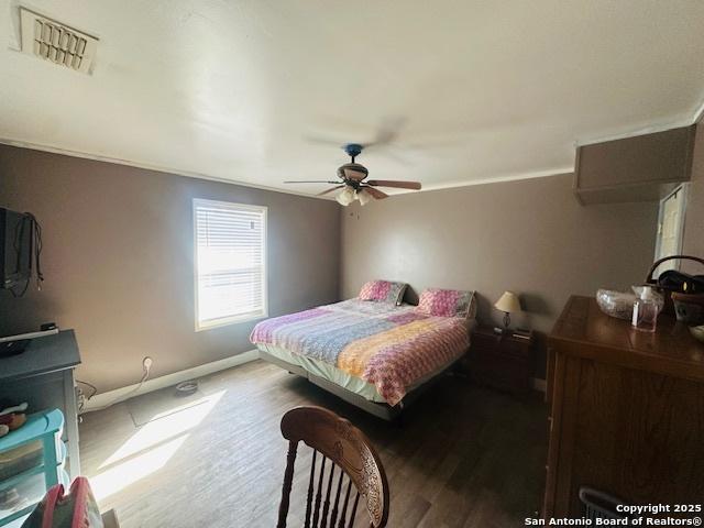 bedroom featuring ceiling fan and wood-type flooring