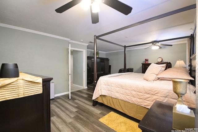 bedroom featuring crown molding, ceiling fan, and dark wood-type flooring