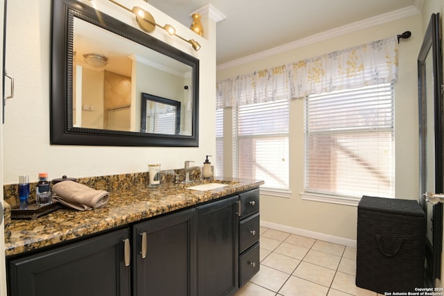 bathroom with vanity, crown molding, and tile patterned floors