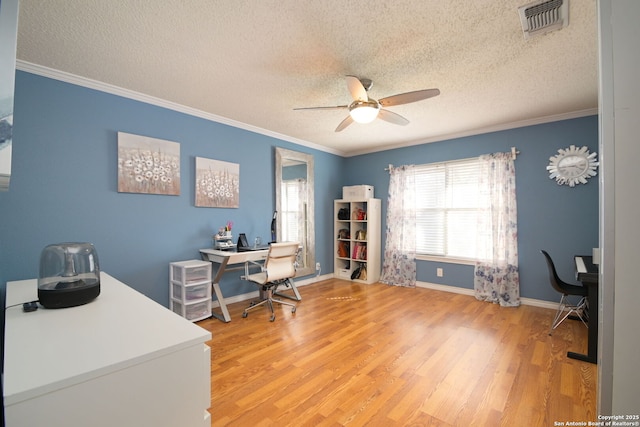 office space featuring hardwood / wood-style flooring, ornamental molding, a textured ceiling, and ceiling fan