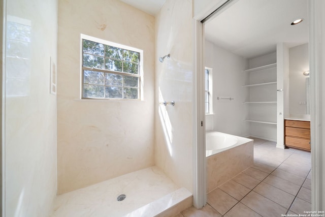 bathroom with tile patterned flooring and plus walk in shower