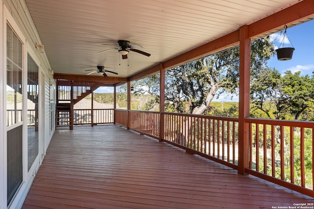 wooden deck featuring ceiling fan