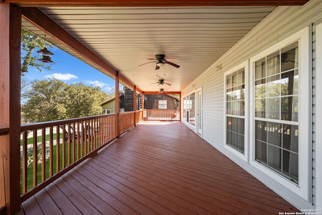 deck featuring ceiling fan and covered porch