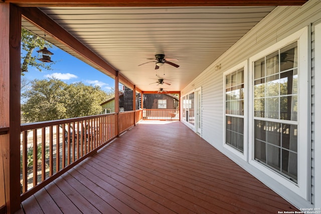 deck featuring ceiling fan and a porch