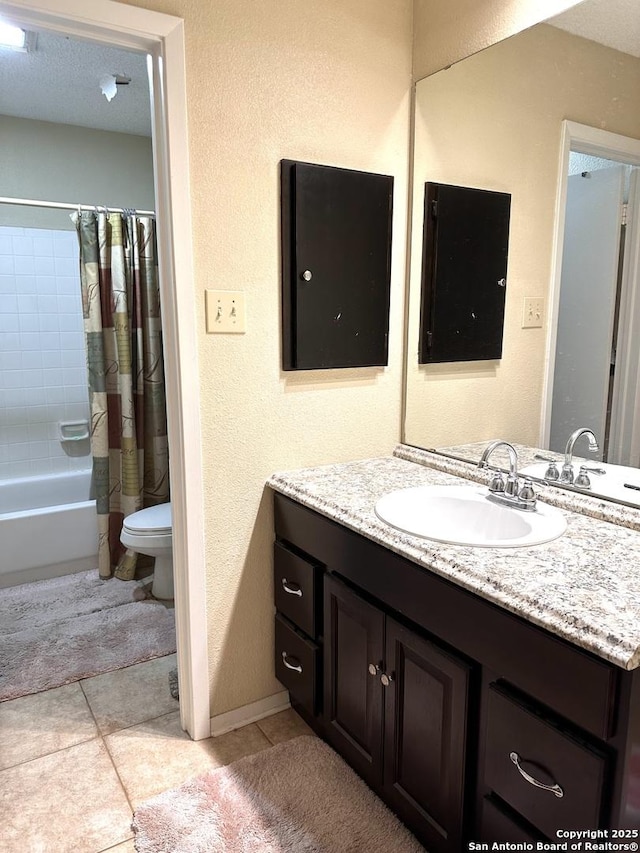 full bathroom featuring vanity, shower / bath combination with curtain, tile patterned floors, and toilet