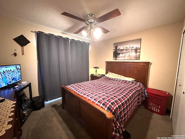 carpeted bedroom featuring ceiling fan and a textured ceiling