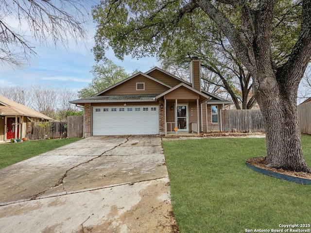 view of front of house with a garage and a front yard