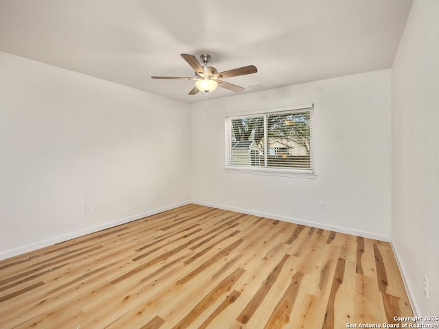 unfurnished room with ceiling fan and light wood-type flooring