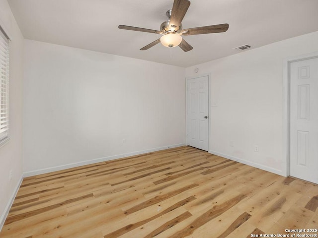 spare room featuring ceiling fan and light hardwood / wood-style flooring