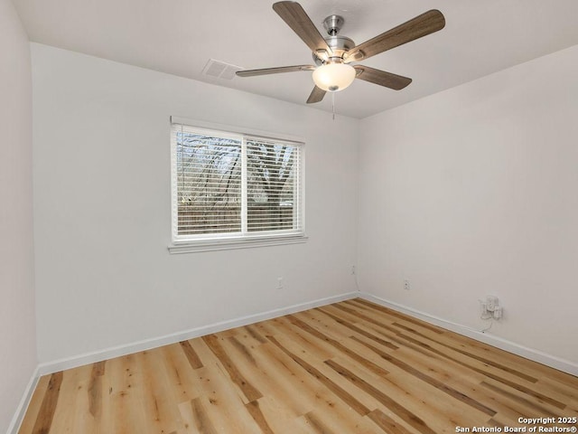 spare room with ceiling fan and light hardwood / wood-style floors