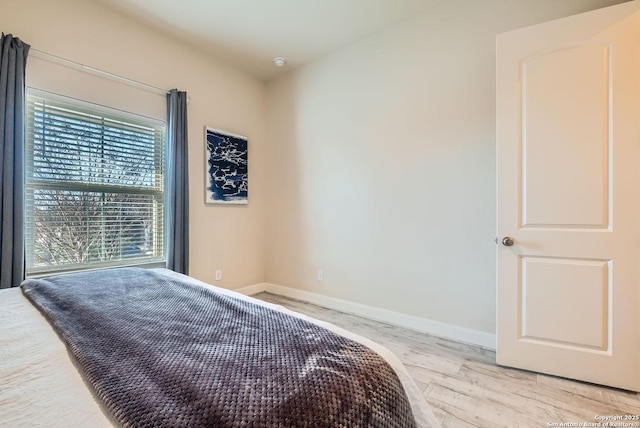 bedroom featuring light wood-type flooring