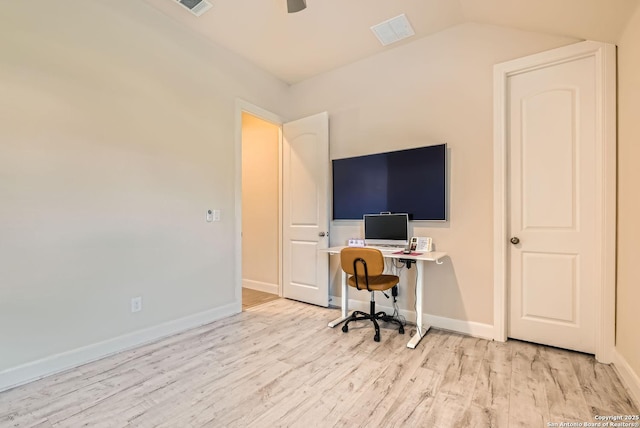 home office with lofted ceiling, ceiling fan, and light hardwood / wood-style flooring