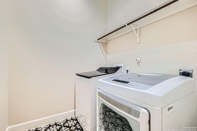 laundry room featuring separate washer and dryer