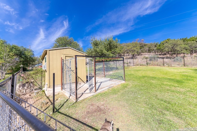 view of outbuilding with a lawn