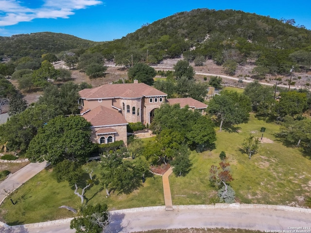 birds eye view of property with a mountain view