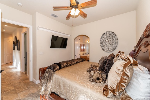 bedroom with connected bathroom and ceiling fan