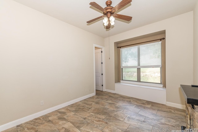 unfurnished room with ceiling fan