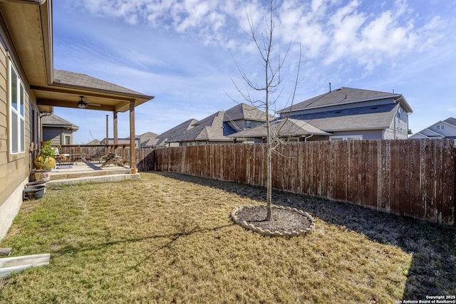 view of yard with ceiling fan